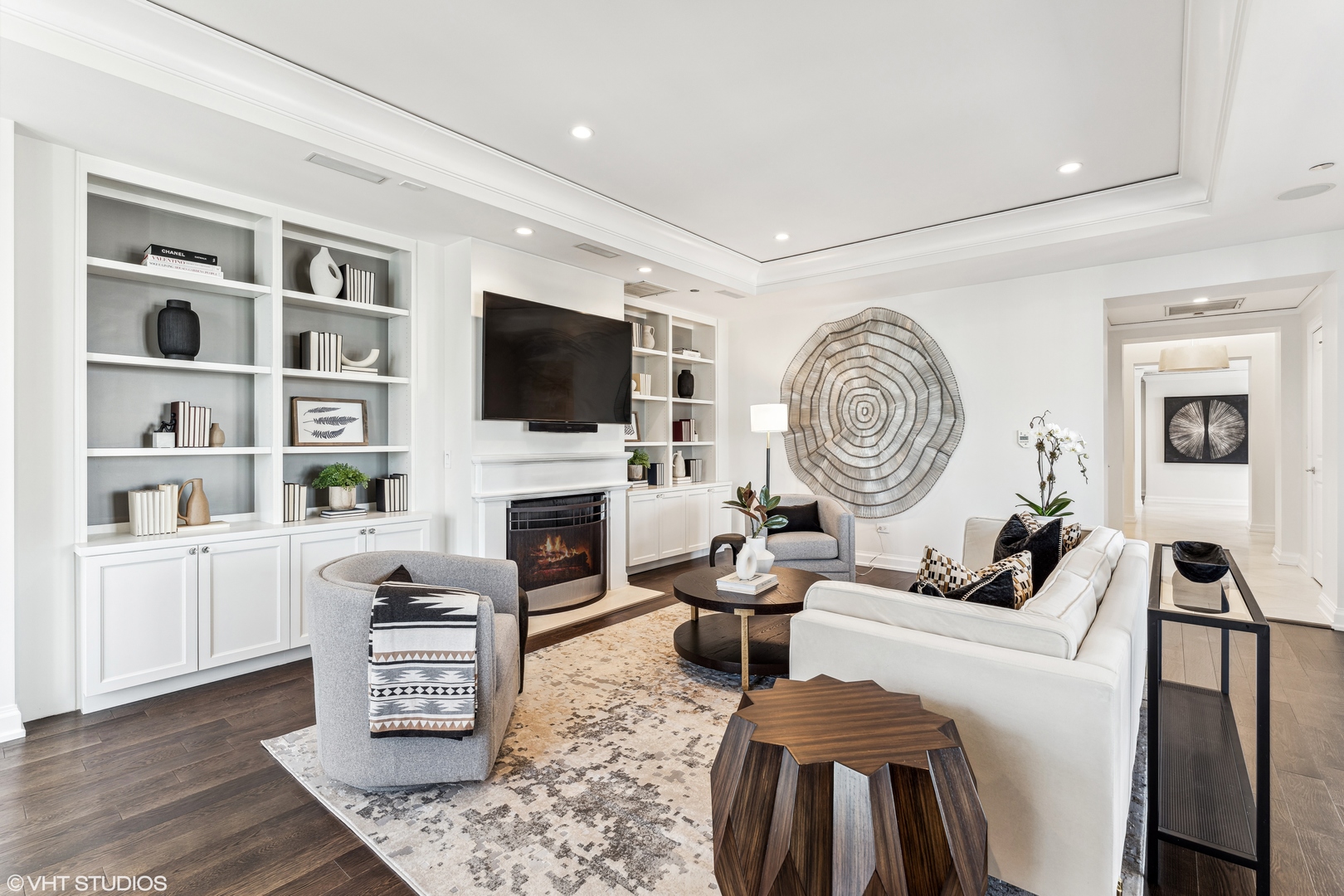 11 East Walton Street, Unit 4202 Chicago, IL 60611 - Photo 6 of 48 a living room with furniture a flat screen tv and a fireplace