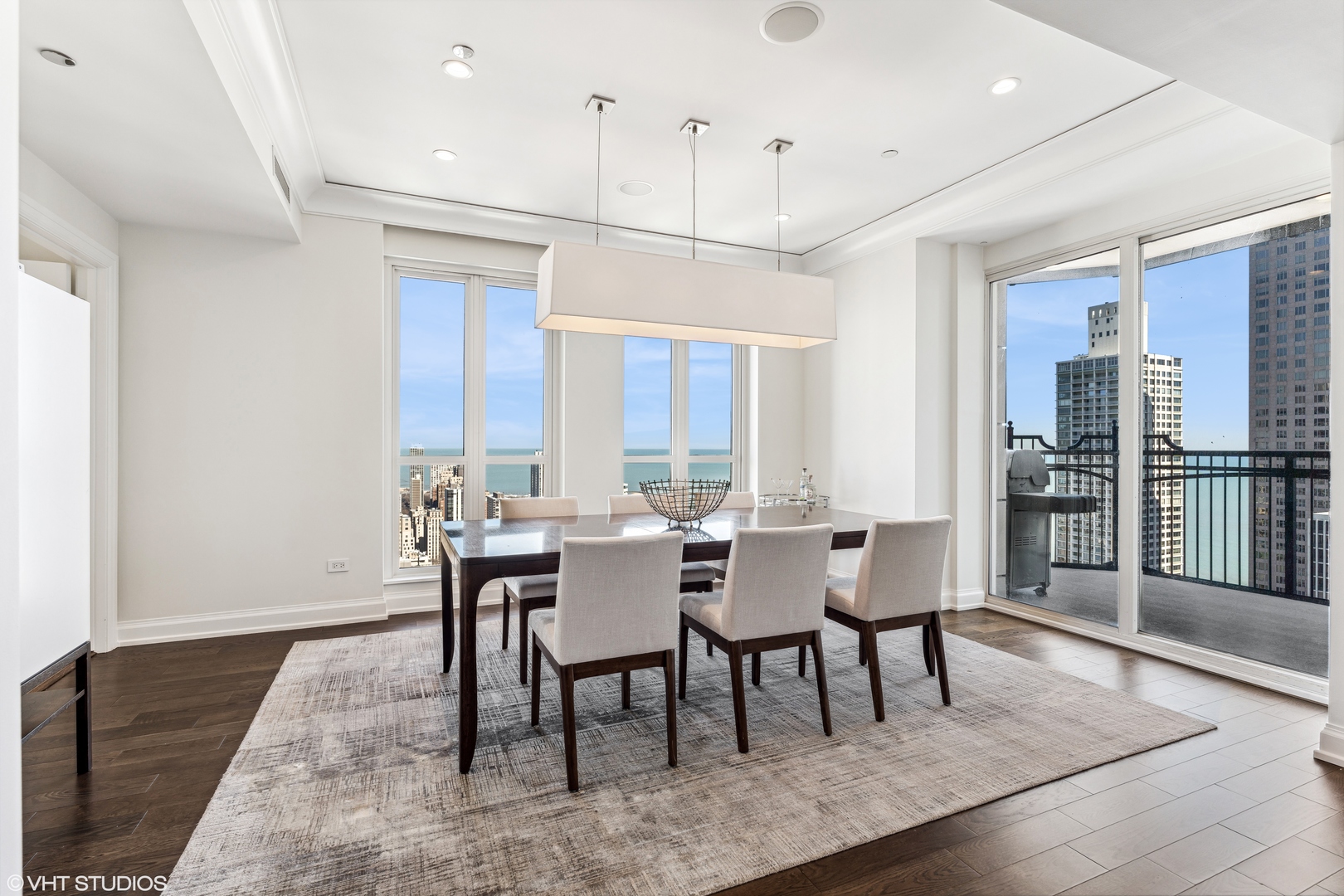 11 East Walton Street, Unit 4202 Chicago, IL 60611 - Photo 10 of 48 a view of a dining room with furniture