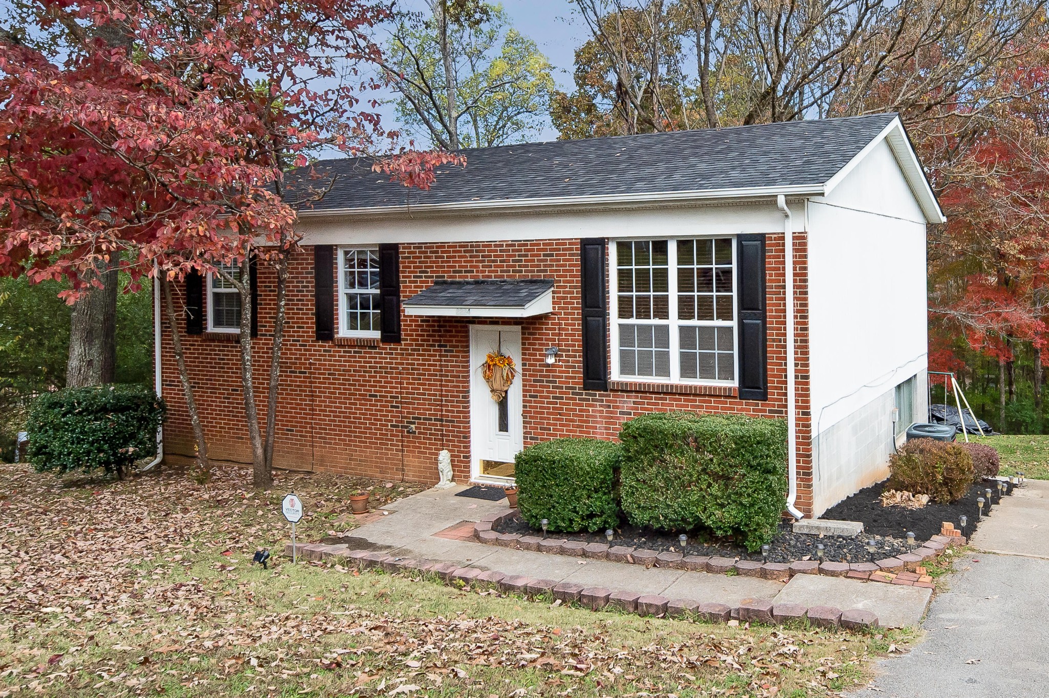 2224 Roundtree Road Knoxville, TN 37923 - Photo 1 of 22 a front view of a house with a yard and potted plants