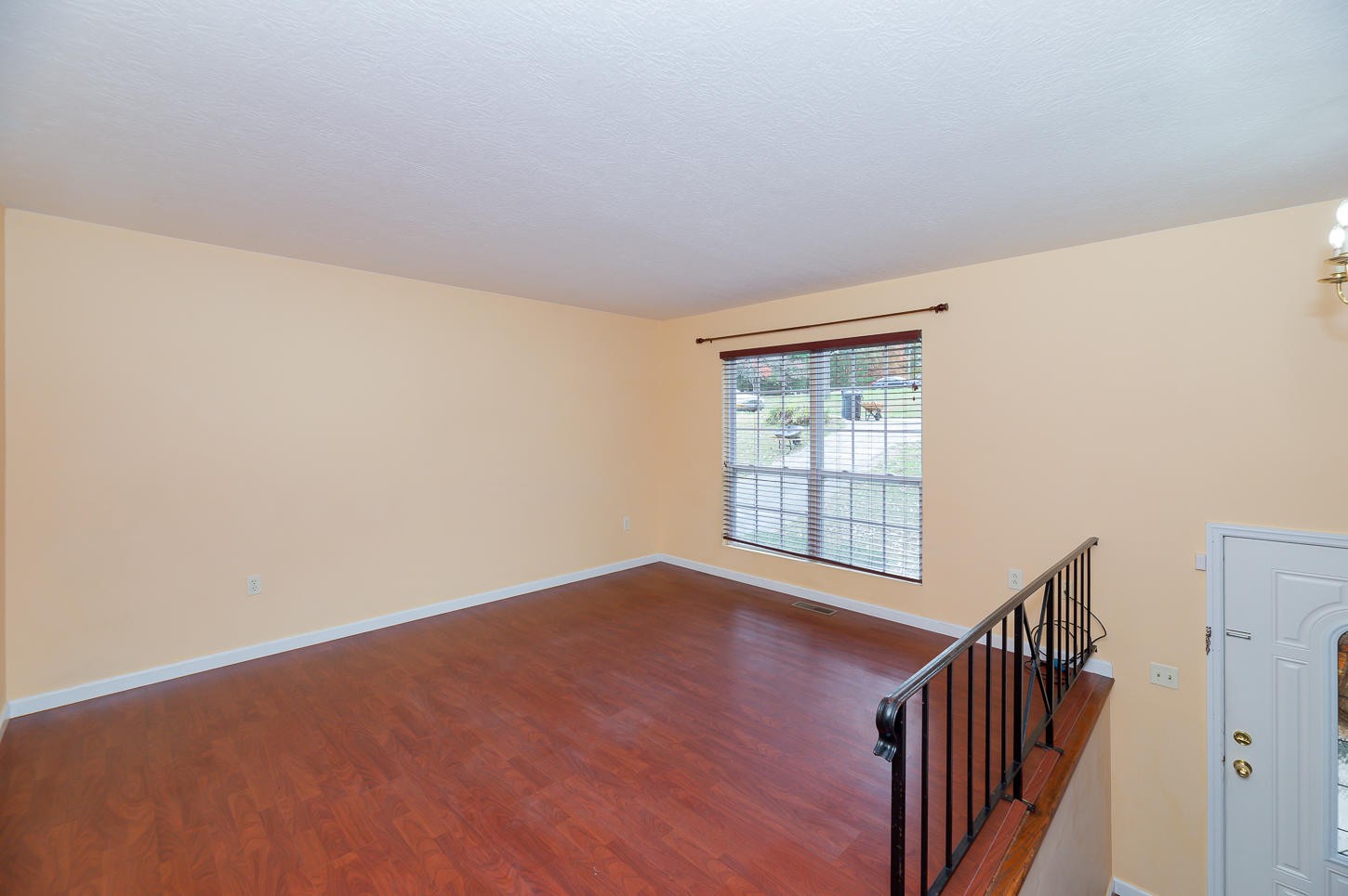 2224 Roundtree Road Knoxville, TN 37923 - Photo 2 of 22 a view of an empty room with wooden floor and a window