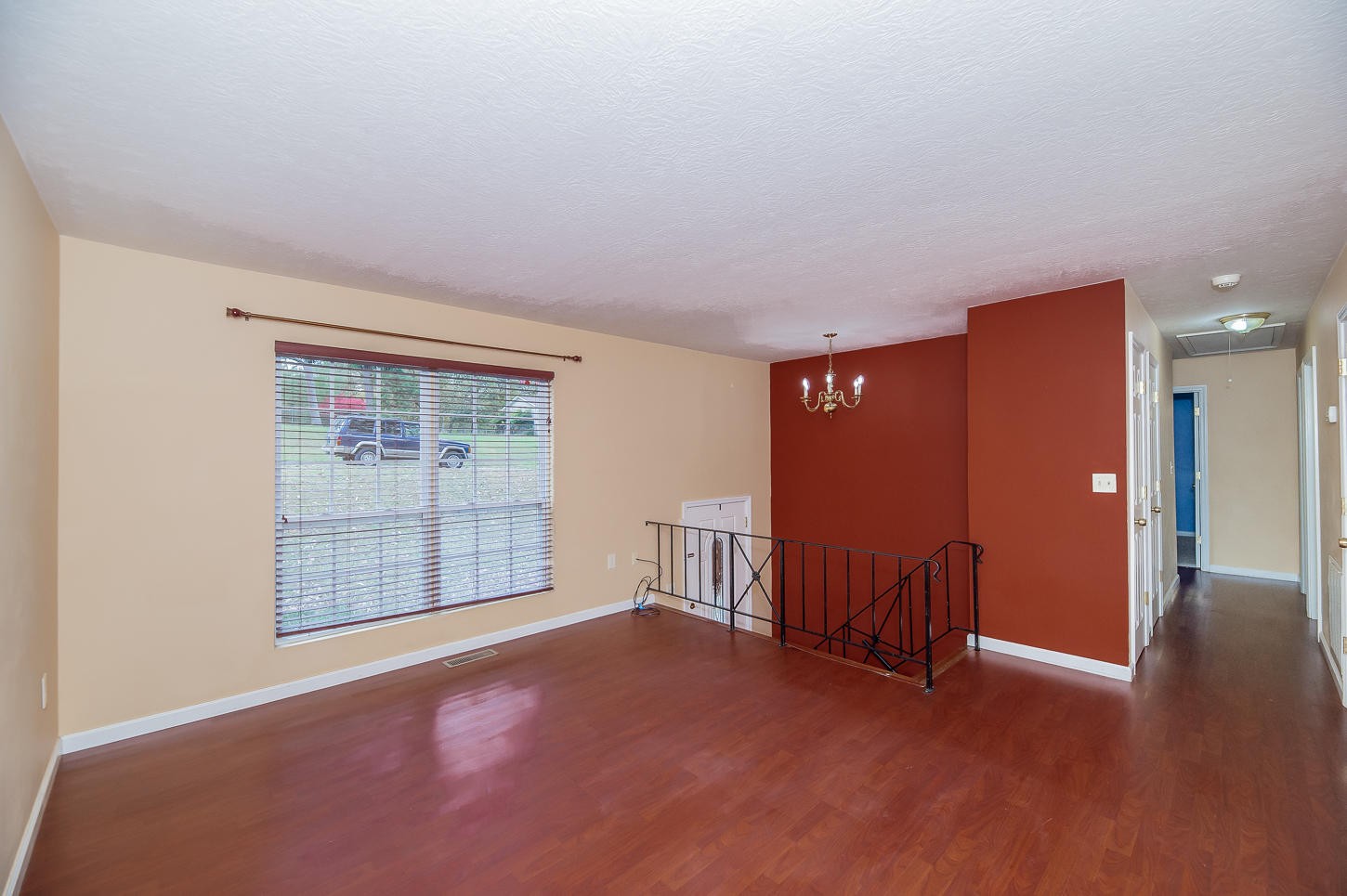 2224 Roundtree Road Knoxville, TN 37923 - Photo 3 of 22 an empty room with a fireplace and wooden floor