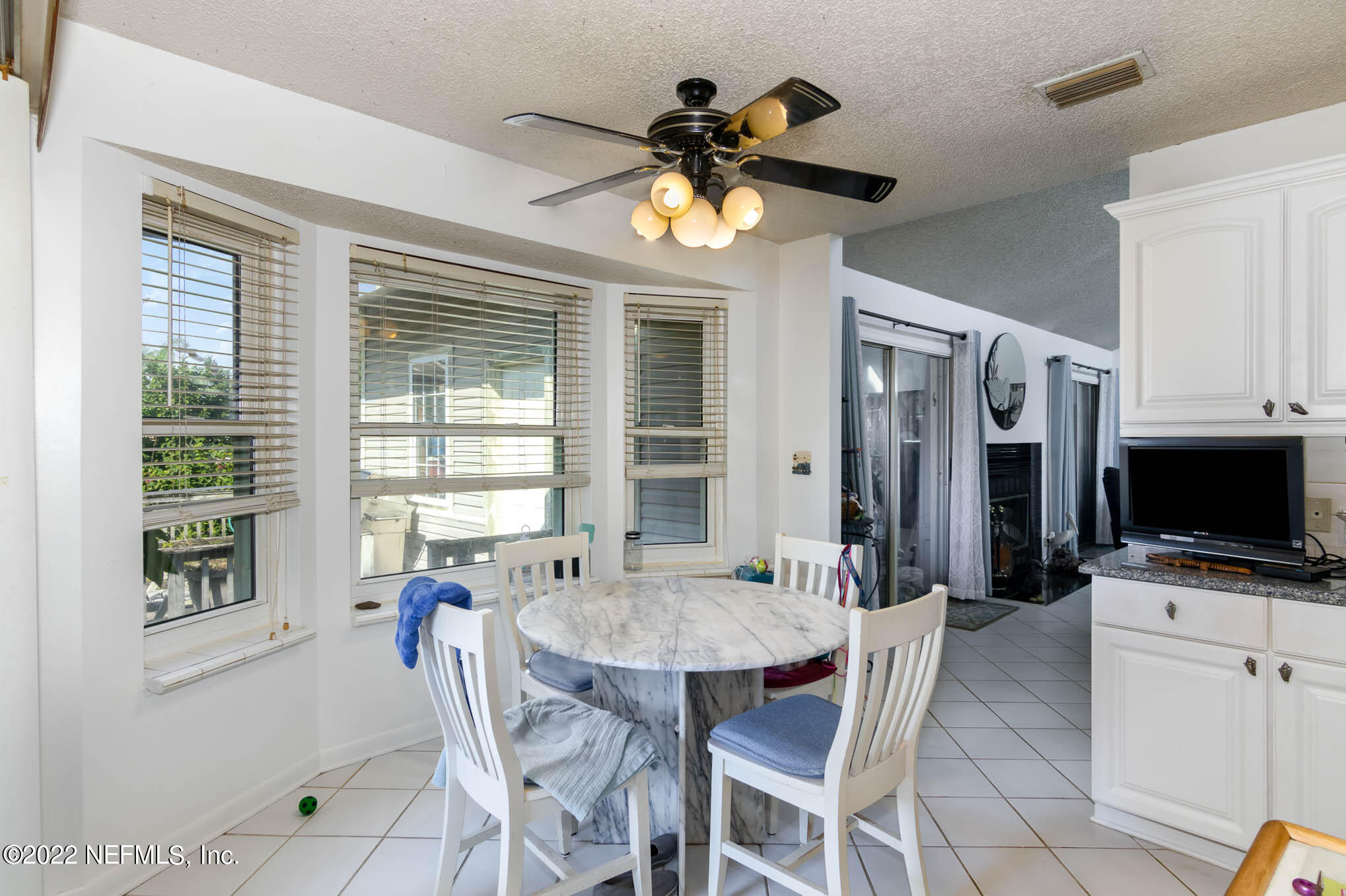7047 Rivercrest Drive Jacksonville, FL 32226 - Photo 13 of 29 a dining room with furniture and window