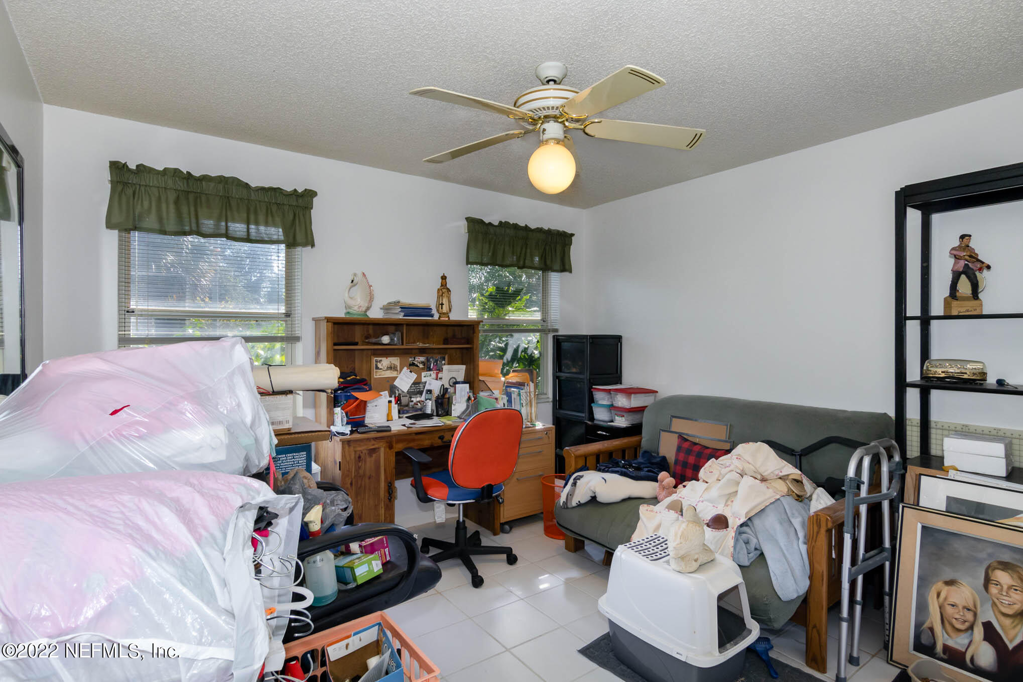 7047 Rivercrest Drive Jacksonville, FL 32226 - Photo 18 of 29 a view of a livingroom with furniture and a chandelier