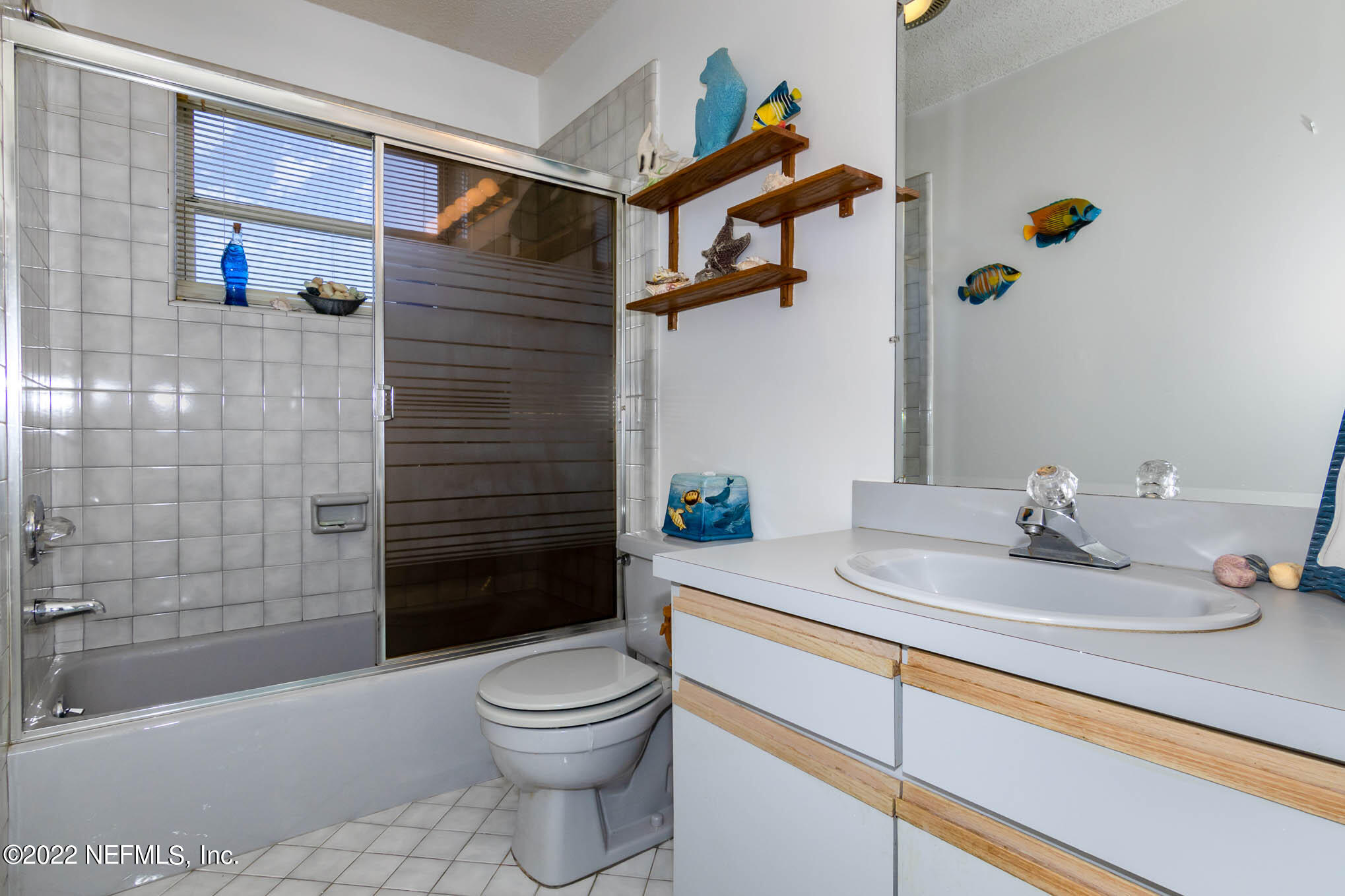 7047 Rivercrest Drive Jacksonville, FL 32226 - Photo 22 of 29 a bathroom with a sink a toilet and shower
