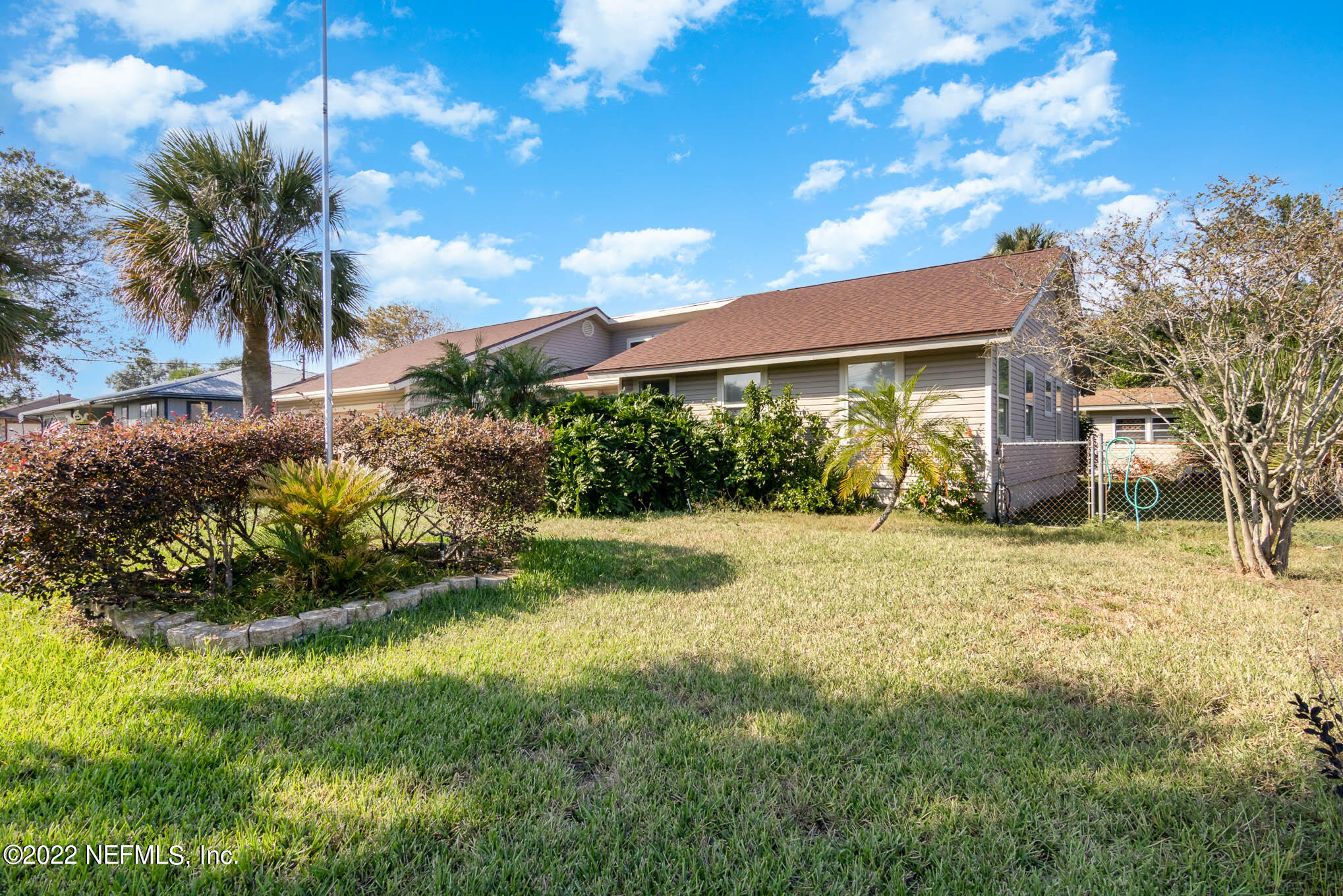 7047 Rivercrest Drive Jacksonville, FL 32226 - Photo 3 of 29 a front view of a house with garden
