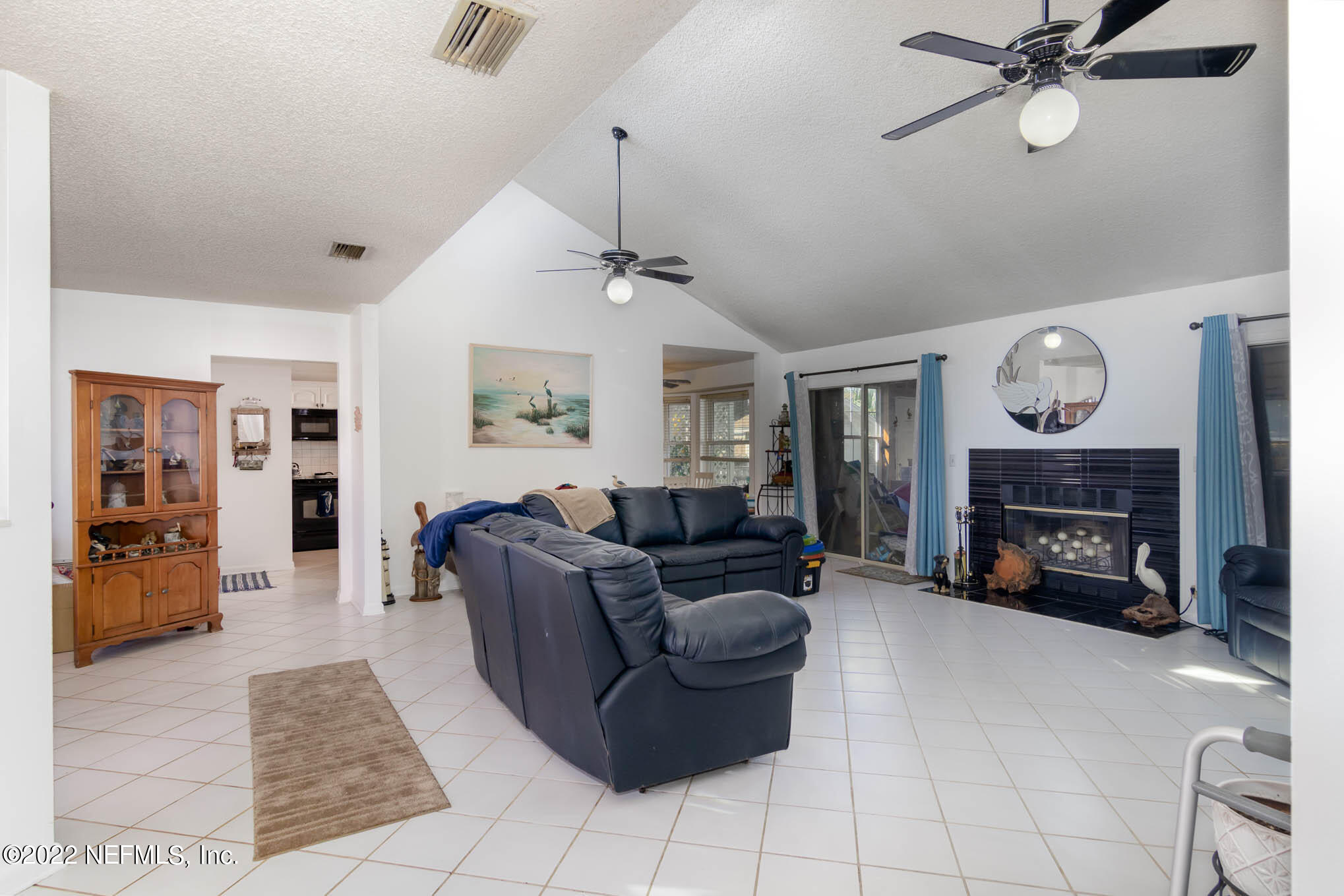 7047 Rivercrest Drive Jacksonville, FL 32226 - Photo 5 of 29 a living room with furniture and a fireplace