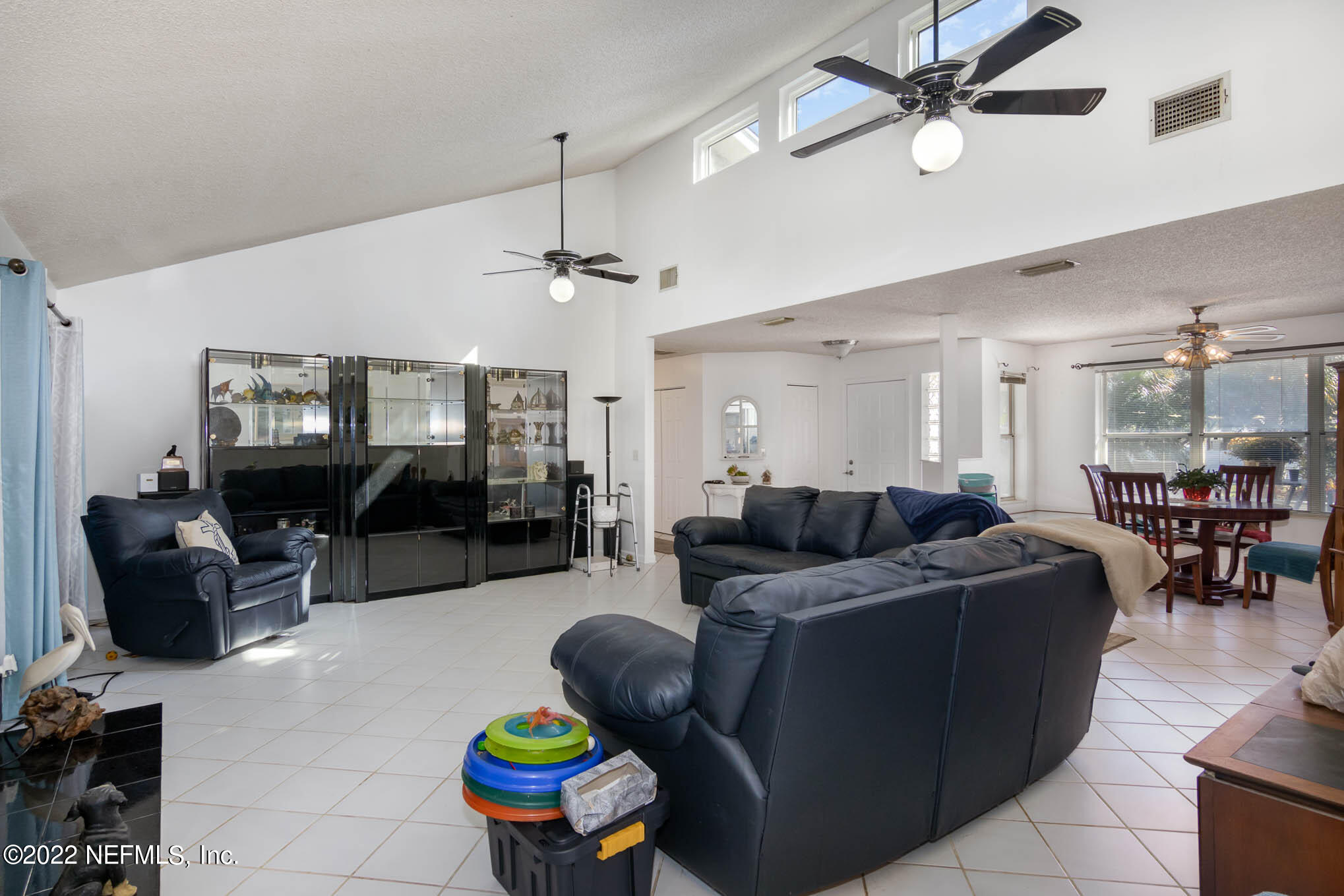 7047 Rivercrest Drive Jacksonville, FL 32226 - Photo 6 of 29 a living room with furniture and a flat screen tv