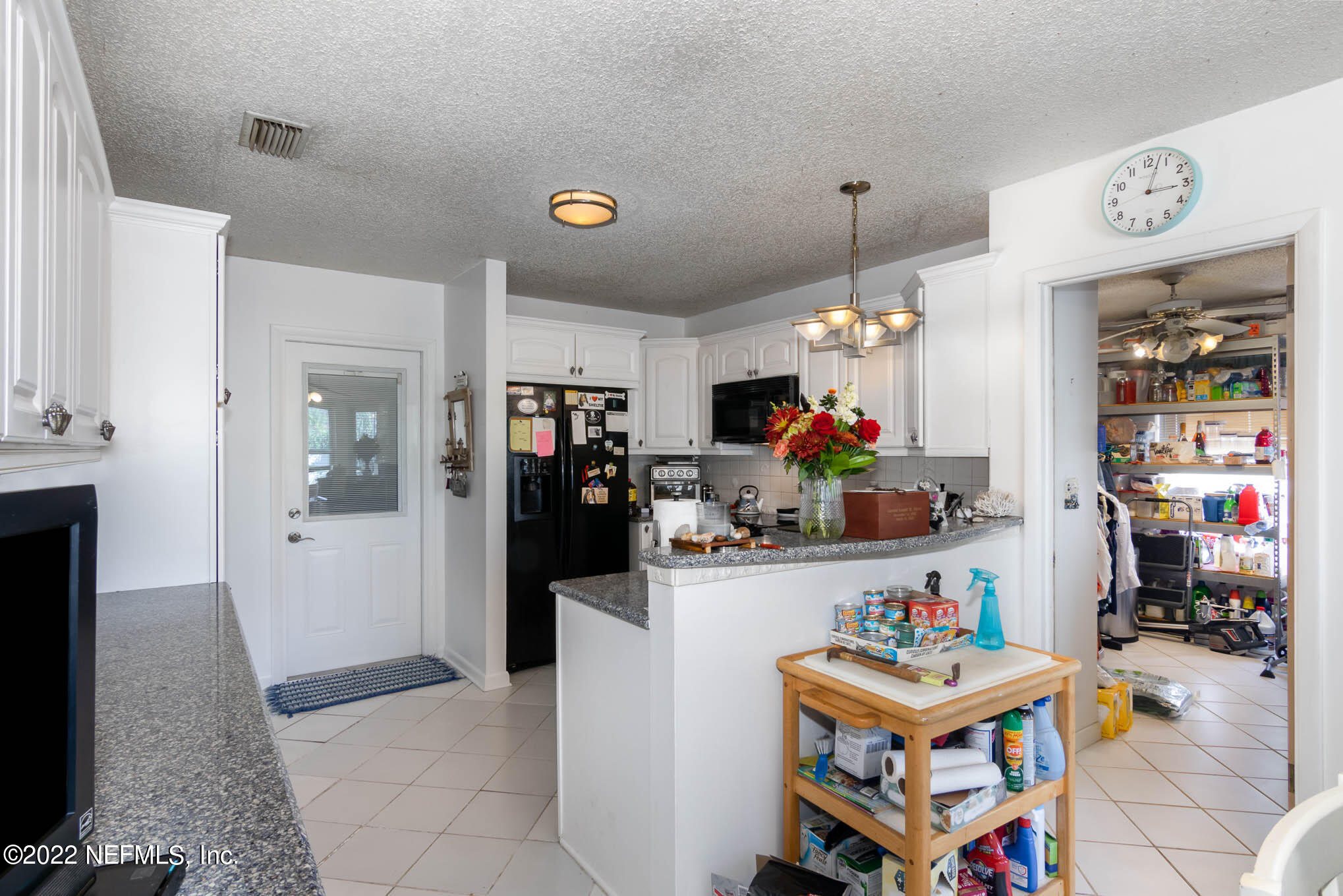 7047 Rivercrest Drive Jacksonville, FL 32226 - Photo 10 of 29 a living room with furniture and a flat screen tv