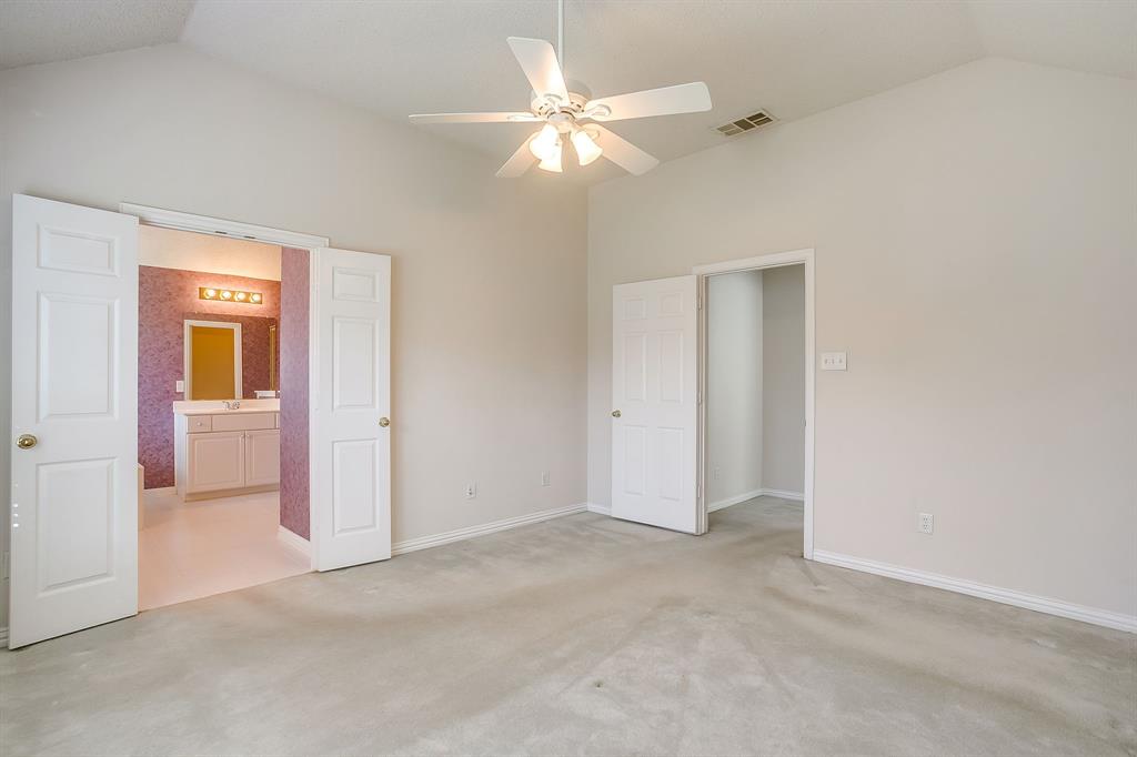 8105 Hosta Way Fort Worth, TX 76123 - Photo 22 of 33 an empty room with closet and a ceiling fan