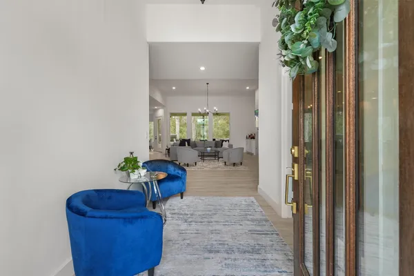 a living room with furniture and a potted plant