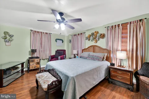 a bedroom with bed and window