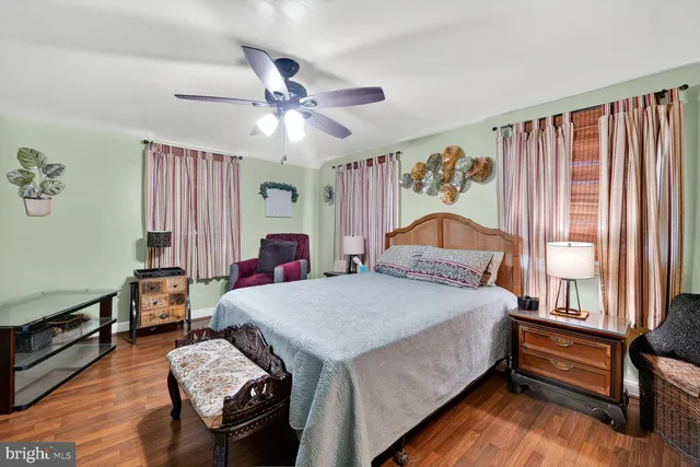 a bedroom with bed and window