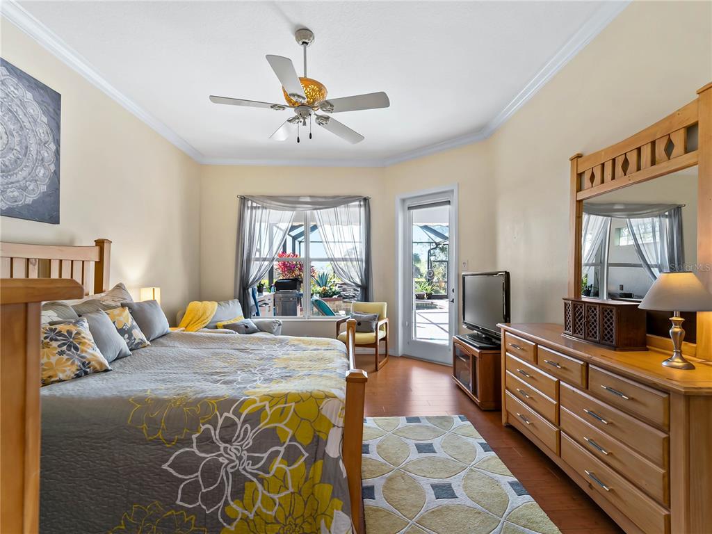 918 Chickadee Drive Venice, FL 34285 - Photo 17 of 85 a bed room with a bed and a television