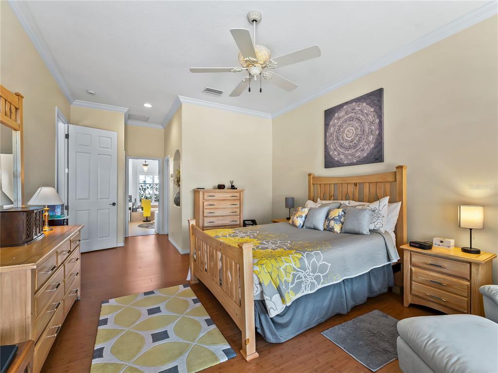 918 Chickadee Drive Venice, FL 34285 - Photo 18 of 85 a bedroom with a bed and furniture