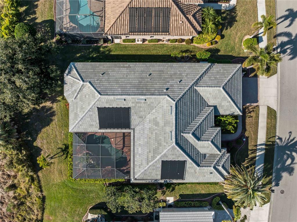 918 Chickadee Drive Venice, FL 34285 - Photo 2 of 85 an aerial view of a house with a yard