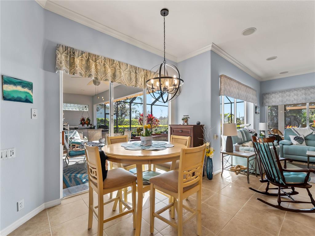 918 Chickadee Drive Venice, FL 34285 - Photo 31 of 85 a view of a dining room with furniture window and outside view