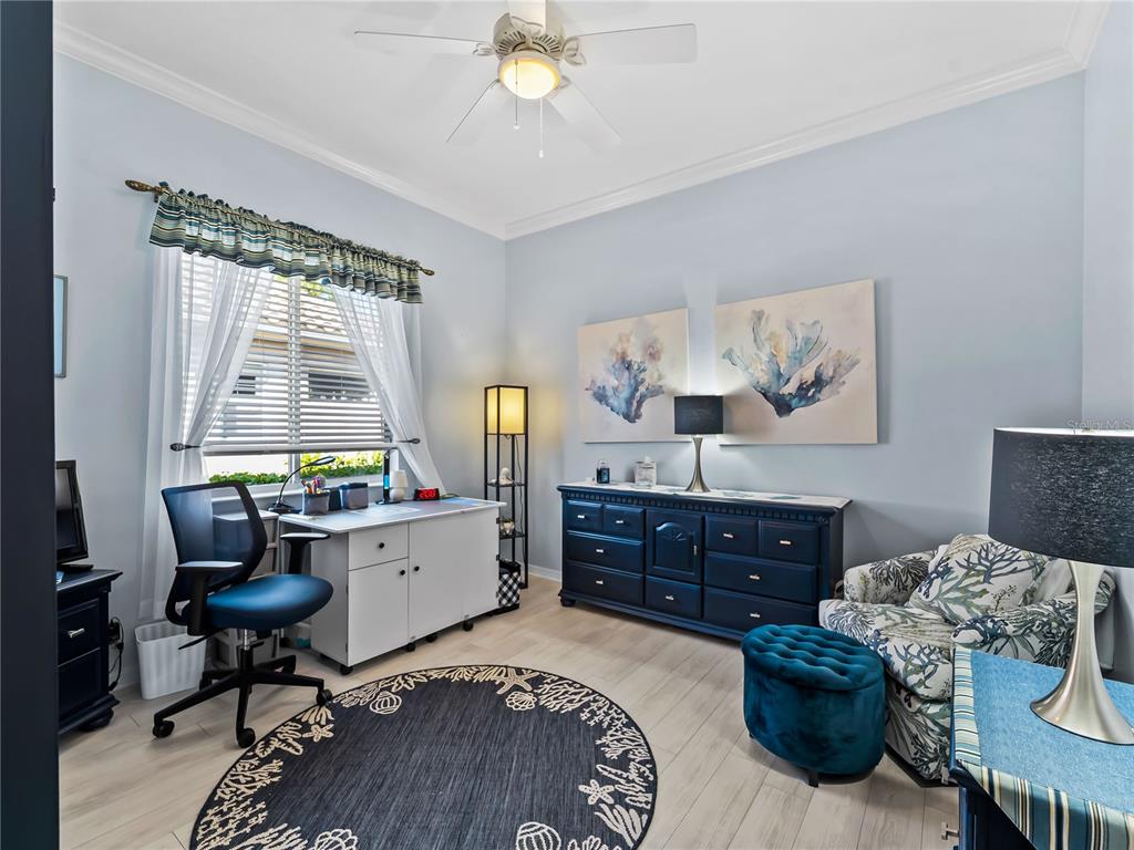 918 Chickadee Drive Venice, FL 34285 - Photo 36 of 85 a bed room with a bed and a dresser