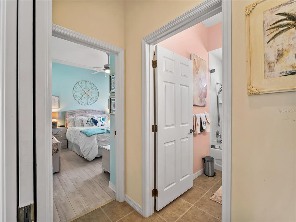 918 Chickadee Drive Venice, FL 34285 - Photo 39 of 85 a en suite bathroom with a tub shower and sink