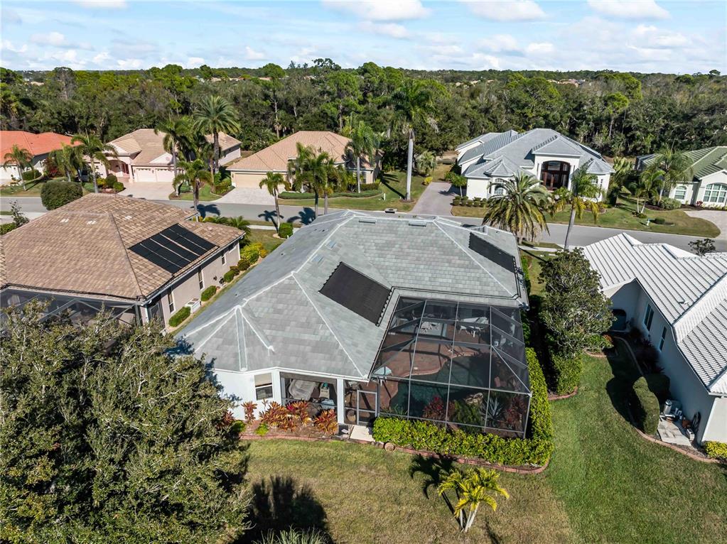 918 Chickadee Drive Venice, FL 34285 - Photo 4 of 85 an aerial view of a house with a garden