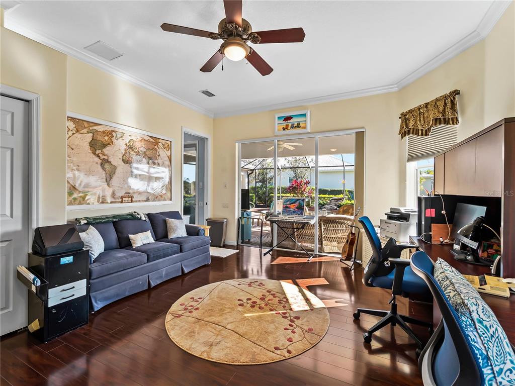 918 Chickadee Drive Venice, FL 34285 - Photo 45 of 85 a living room with furniture and a large window