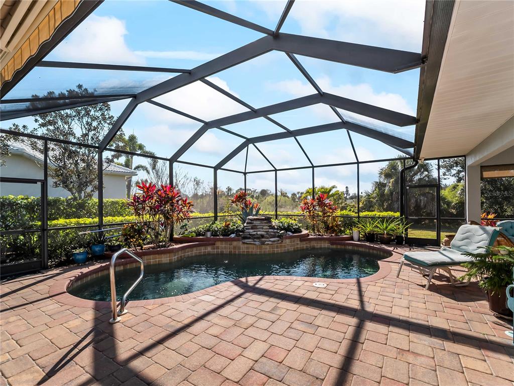 918 Chickadee Drive Venice, FL 34285 - Photo 50 of 85 a view of swimming pool with outdoor seating and plants