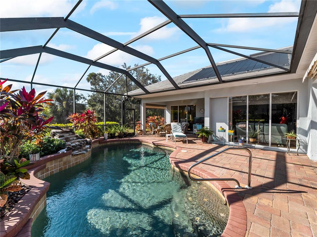 918 Chickadee Drive Venice, FL 34285 - Photo 6 of 85 a view of a swimming pool with a patio