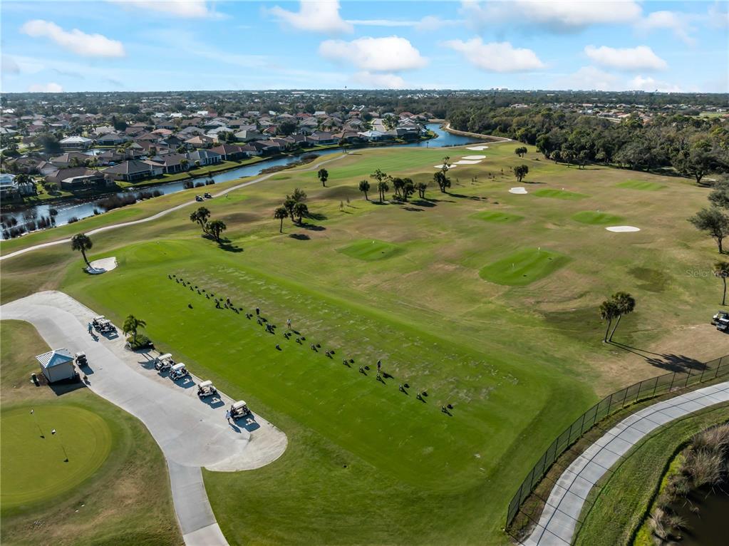 918 Chickadee Drive Venice, FL 34285 - Photo 73 of 85 an aerial view of a swimming pool with a yard
