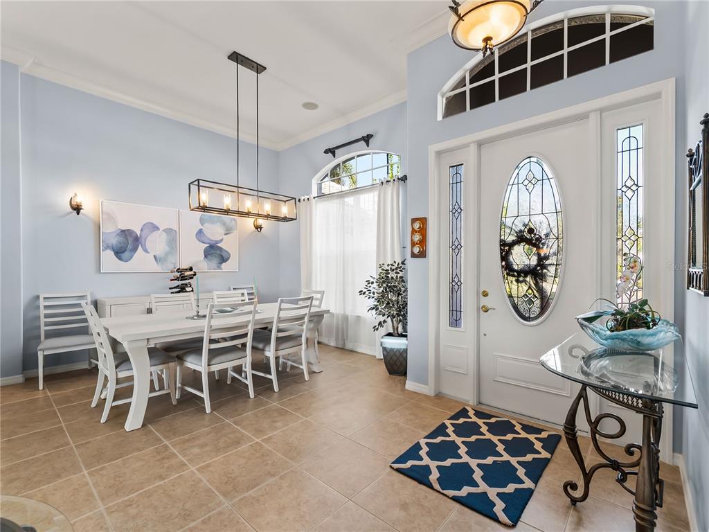 918 Chickadee Drive Venice, FL 34285 - Photo 9 of 85 a view of a dining room with furniture and chandelier
