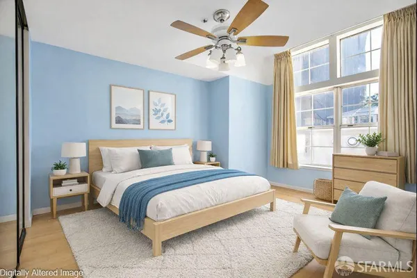 a bedroom with a bed and window