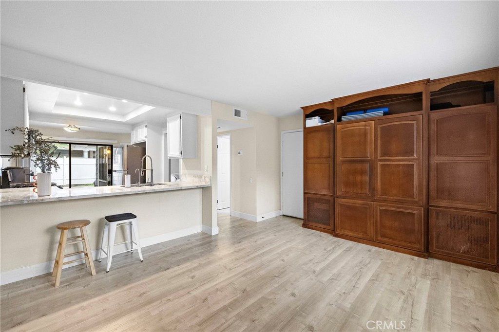 6 Fieldflower Irvine, CA 92614 - Photo 15 of 37 a view of a kitchen with wooden floor and cabinets