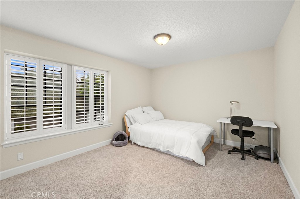 6 Fieldflower Irvine, CA 92614 - Photo 24 of 37 a bedroom with a bed and a window