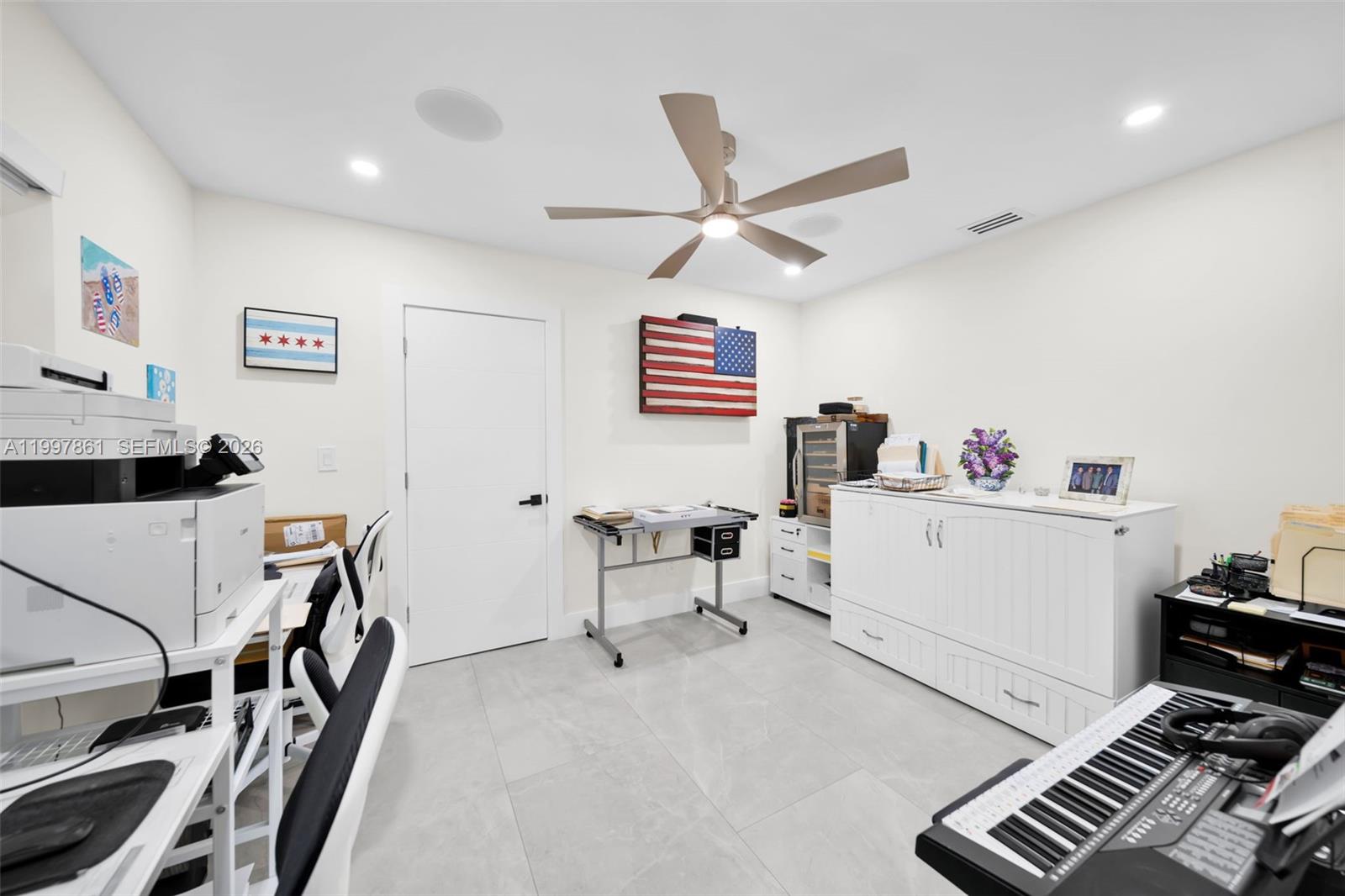 1574 Ricardo Avenue Fort Myers, FL 33901 - Photo 23 of 59 a workspace with furniture and ceiling fan