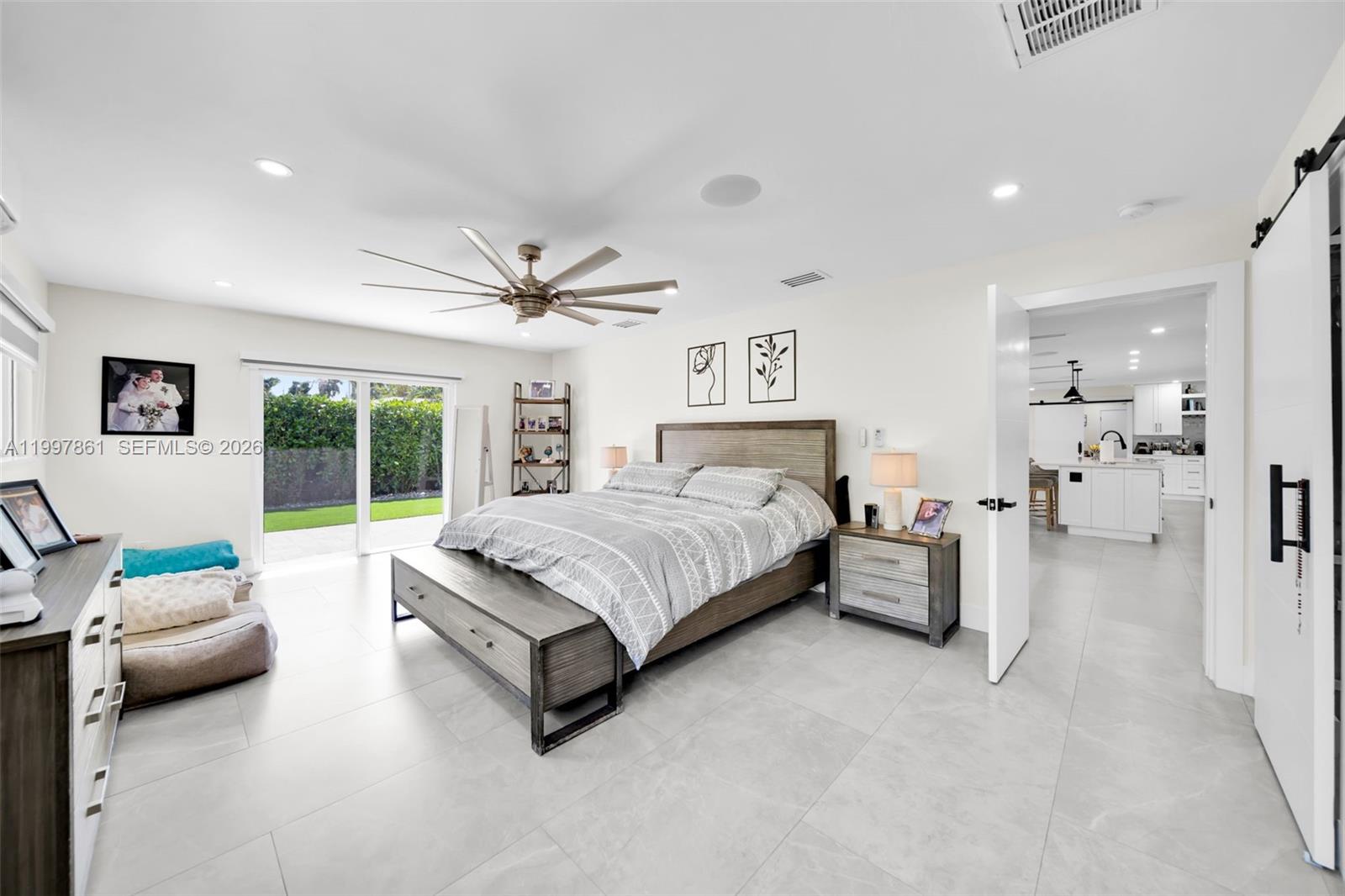 1574 Ricardo Avenue Fort Myers, FL 33901 - Photo 26 of 59 a bedroom with a bed and a couch