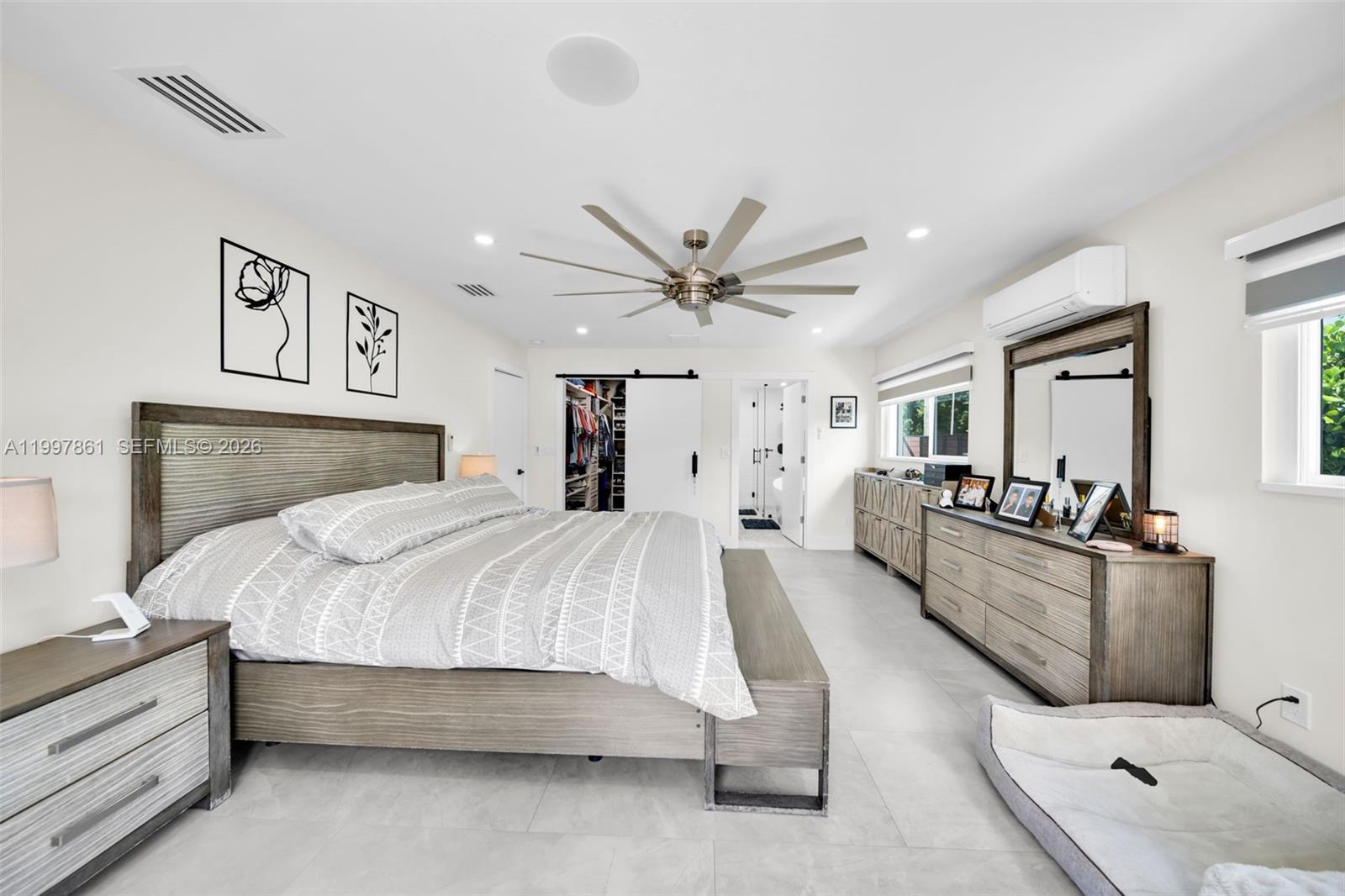 1574 Ricardo Avenue Fort Myers, FL 33901 - Photo 28 of 59 a bed room with a bed and a couch