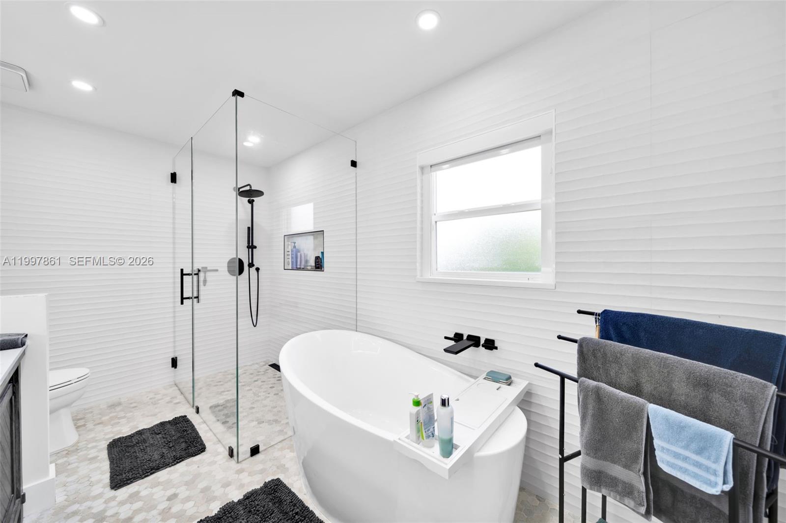 1574 Ricardo Avenue Fort Myers, FL 33901 - Photo 30 of 59 a bathroom with a tub and a sink