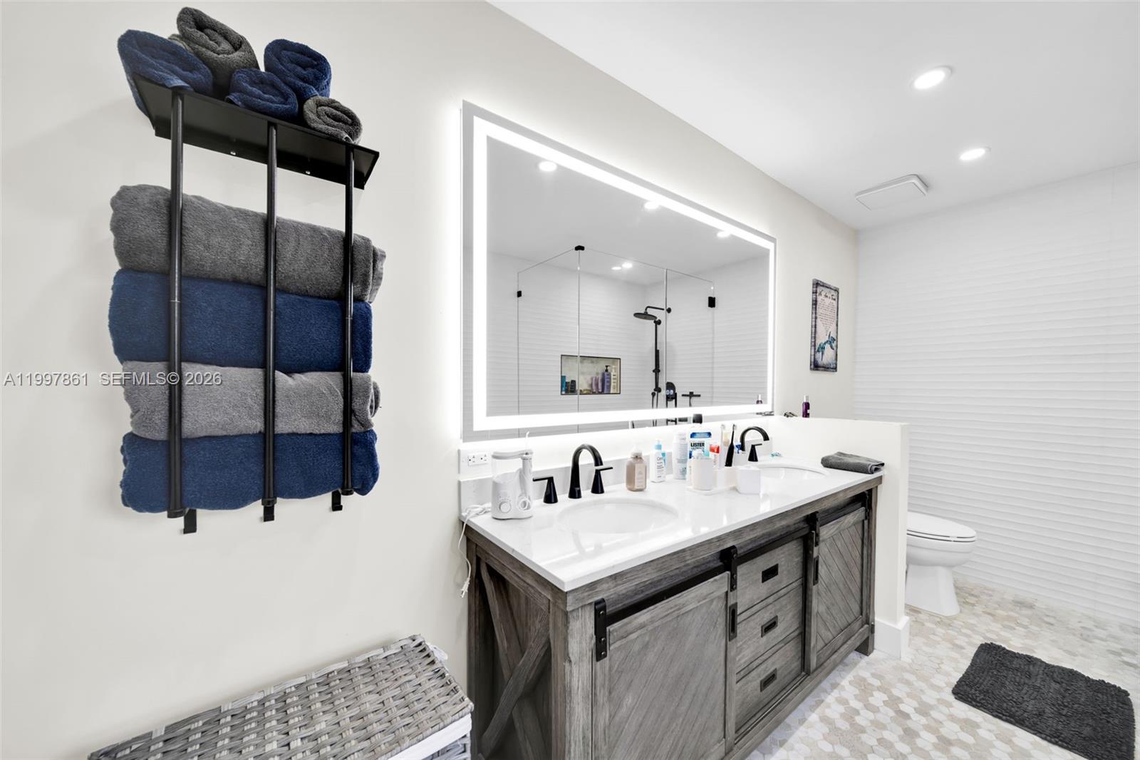 1574 Ricardo Avenue Fort Myers, FL 33901 - Photo 31 of 59 a bathroom with a sink and a mirror