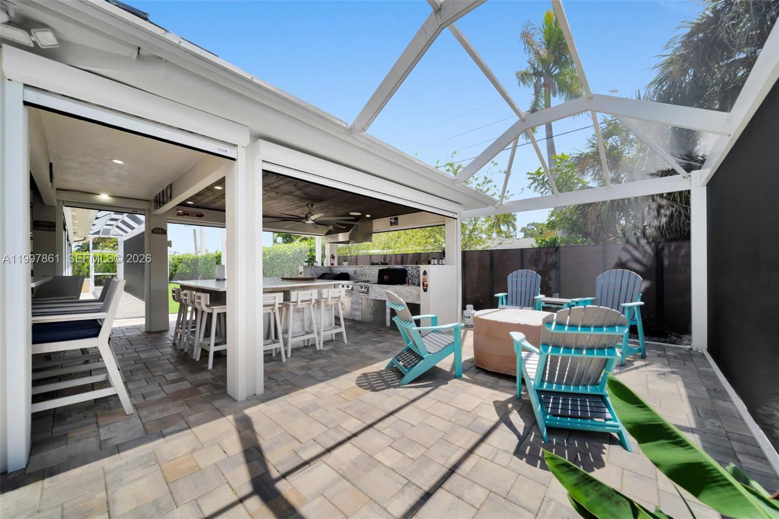 1574 Ricardo Avenue Fort Myers, FL 33901 - Photo 42 of 59 a view of a patio with a dining table and chairs