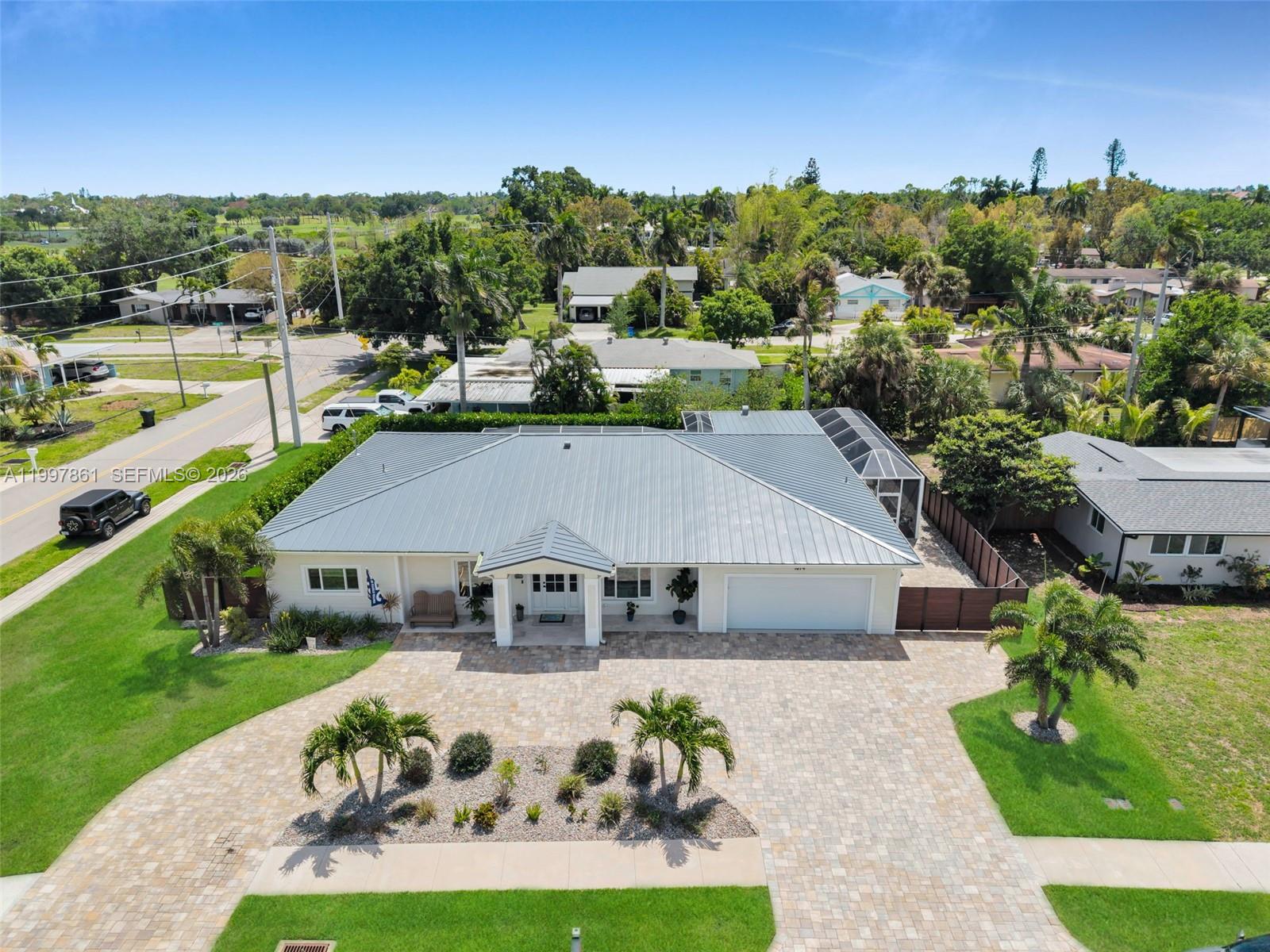 1574 Ricardo Avenue Fort Myers, FL 33901 - Photo 50 of 59 a aerial view of a house with a garden and a yard