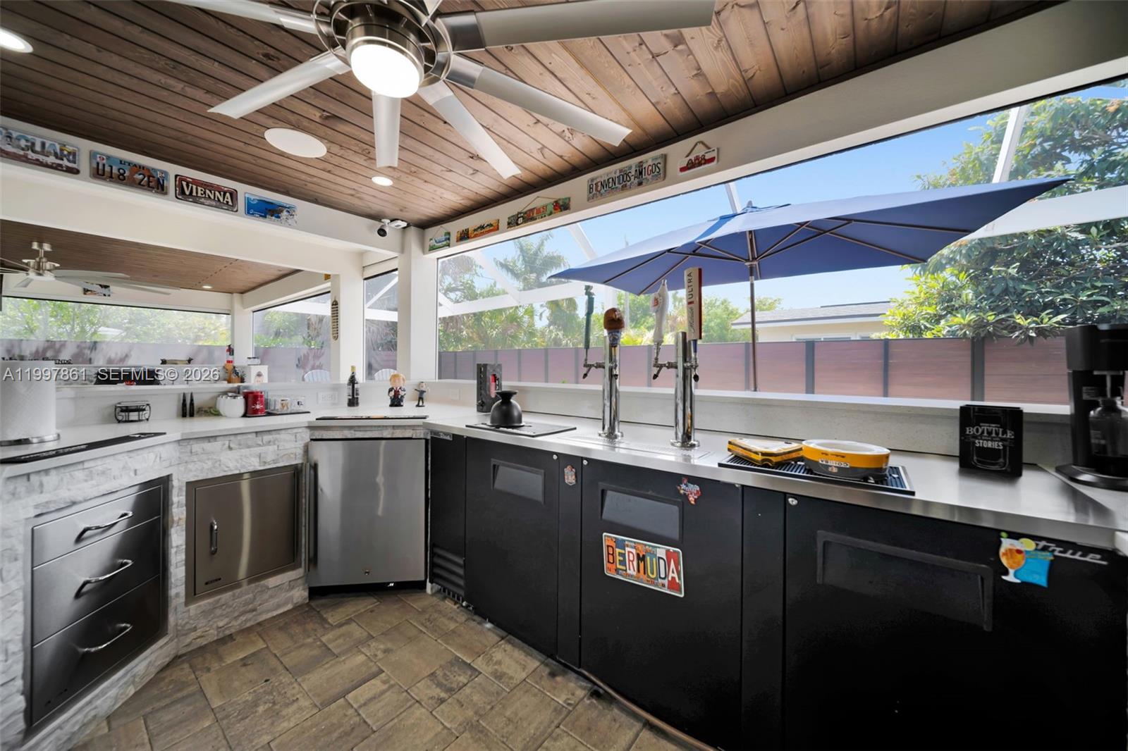1574 Ricardo Avenue Fort Myers, FL 33901 - Photo 9 of 59 a kitchen with stainless steel appliances granite countertop a sink a stove a counter space a sink and cabinets