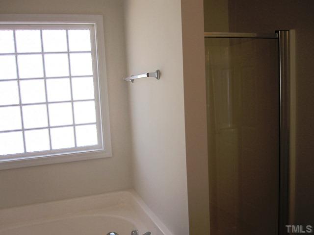 2540 Follow Me Way, Unit LOT65 Raleigh, NC 27610 - Photo 15 of 16 Master bath w/seperate tub & shower and block window.