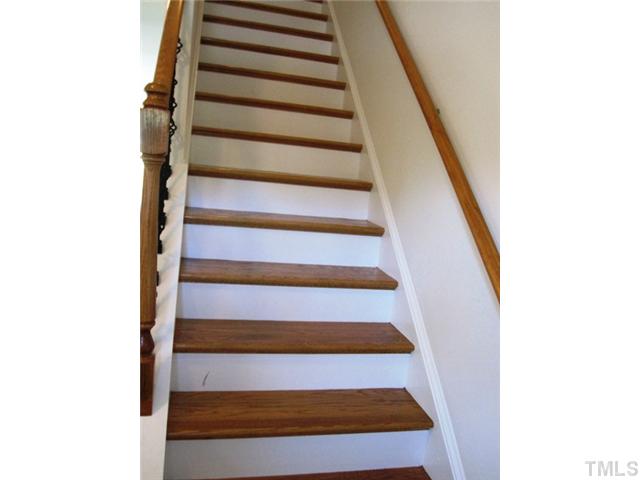2540 Follow Me Way, Unit LOT65 Raleigh, NC 27610 - Photo 4 of 16 Oak hardwood staircase.