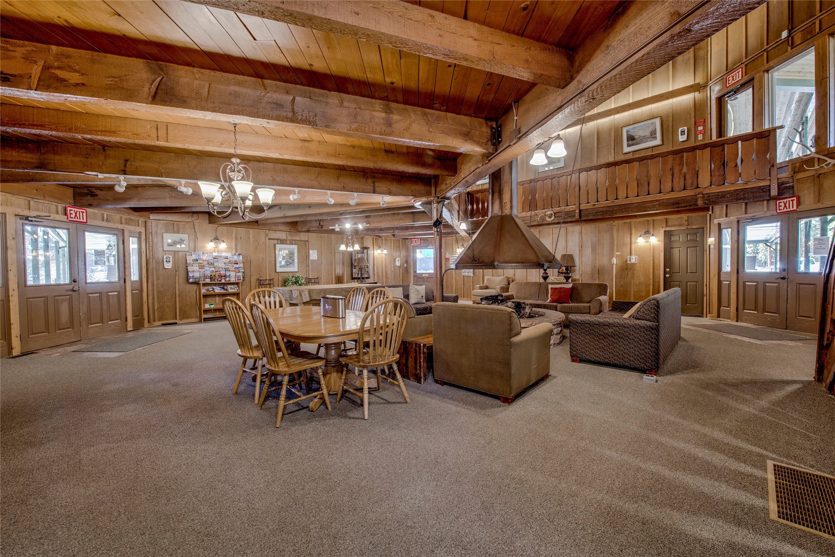 110 Sawmill Road, Unit 7A Breckenridge, CO 80424 - Photo 10 of 27 Dining area featuring beam ceiling, wooden walls, and carpet flooring