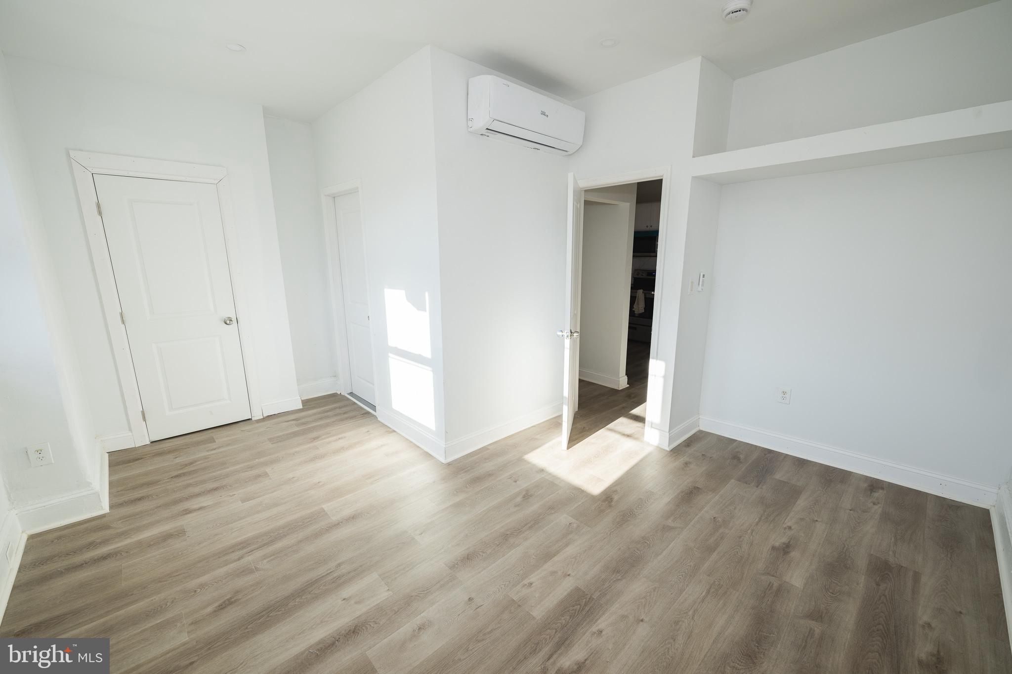 427 North 33rd Street Philadelphia, PA 19104 - Photo 8 of 9 a view of an empty room with wooden floor and closet