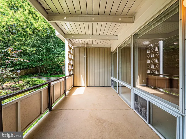 a view of a porch with seating space