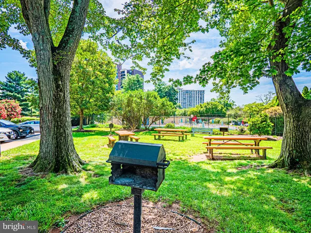 a swimming pool with outdoor seating and yard