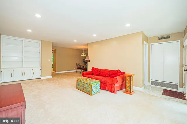 a spacious bedroom with a bed and a couch