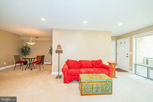 a living room with furniture and a table