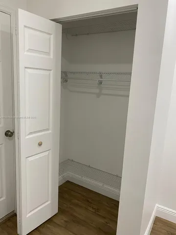 a view of an empty walk in closet