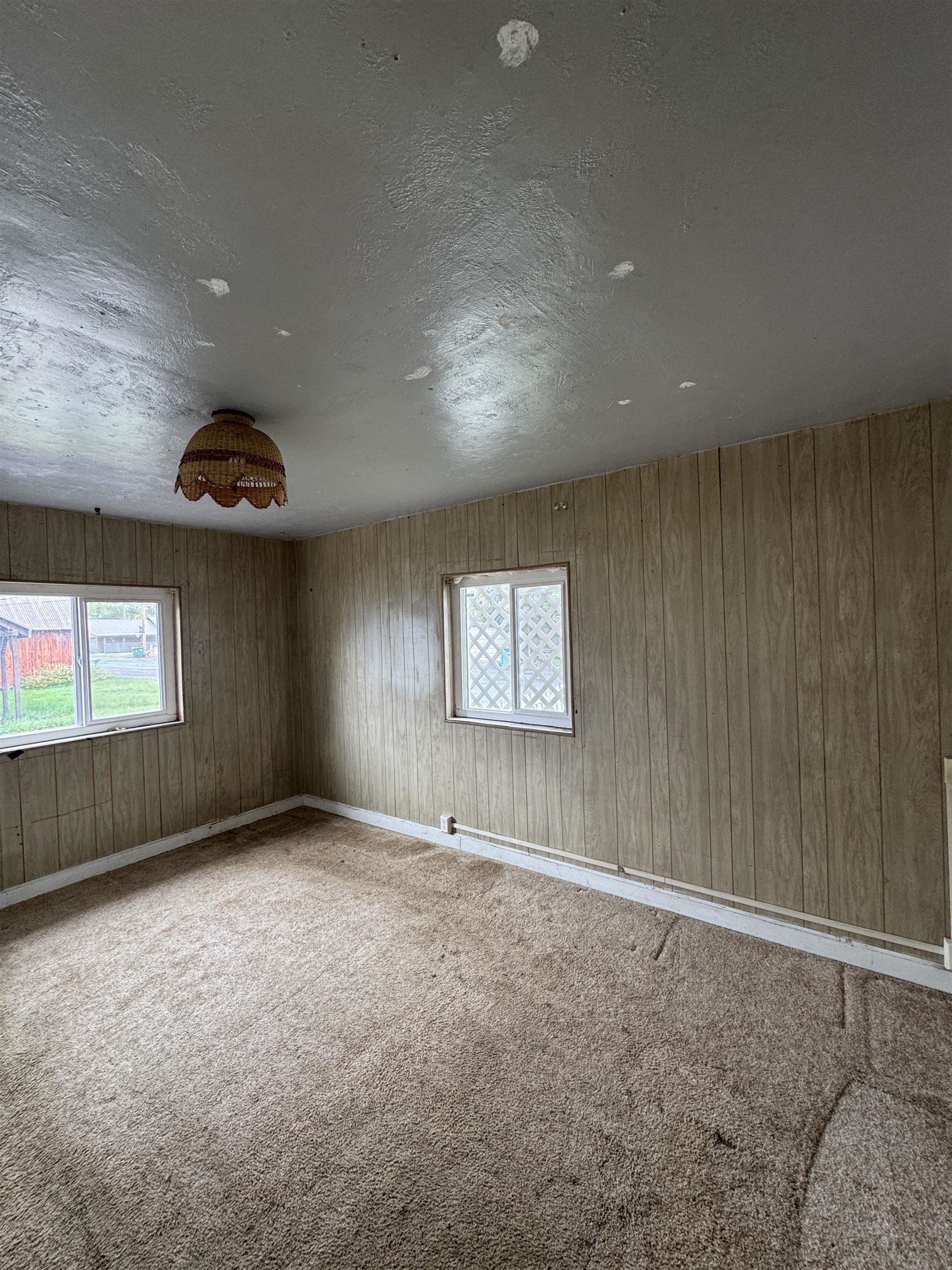 225 Lassen Street Chester, CA 96020 - Photo 8 of 23 an empty room with windows