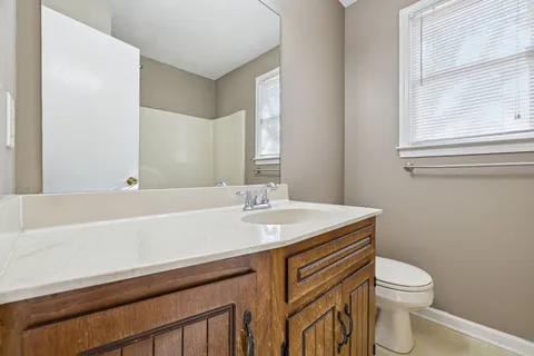 a bathroom with a bath tub with a shower